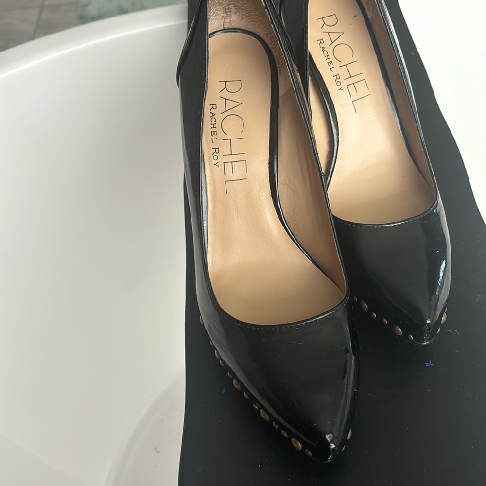 Black heel with gold studded is a chic and edgy shoes. Thick heel closed toe